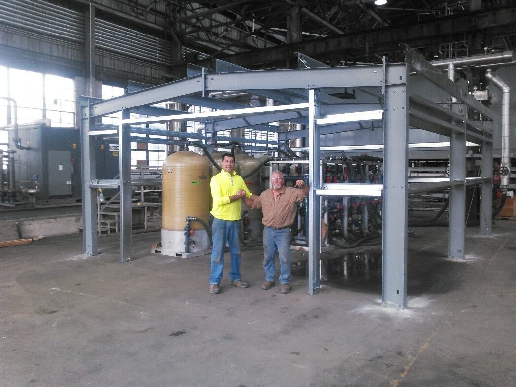 Steel structure foundation with two men